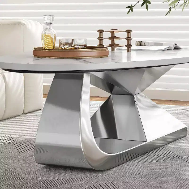 Table basse moderne en pierre frittée avec base sculpturale en acier inoxydable, en forme de galet imitation marbre